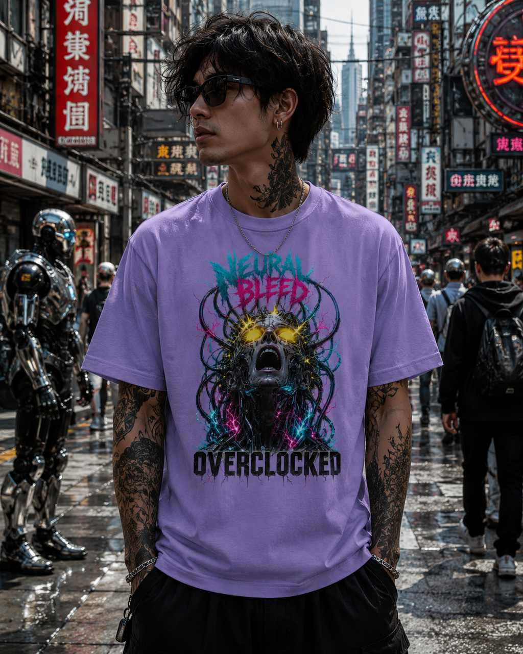 A man wearing a light purple t-shirt with a colorful graphic print of a skull-like creature and the text 'Neural Bleed Overclocked', standing in a busy, rain-slicked street with neon signs.
