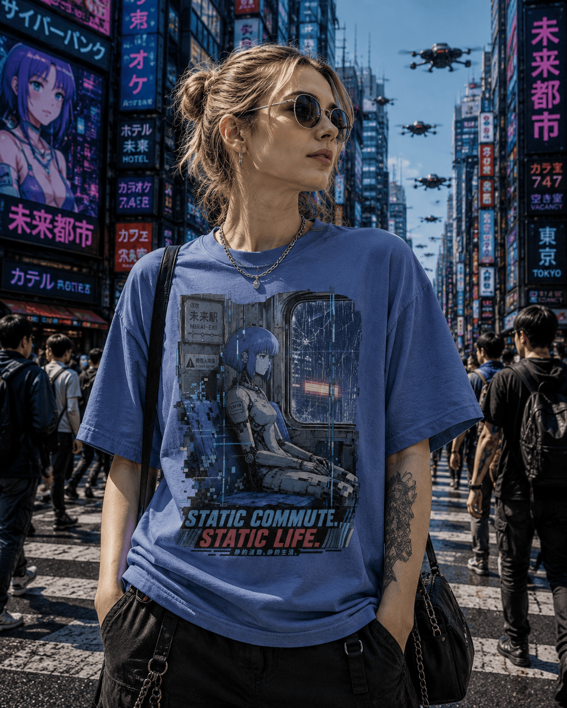 A woman wearing a blue graphic t-shirt with an anime-style commuter design and the text 'STATIC COMMUTE. STATIC LIFE.