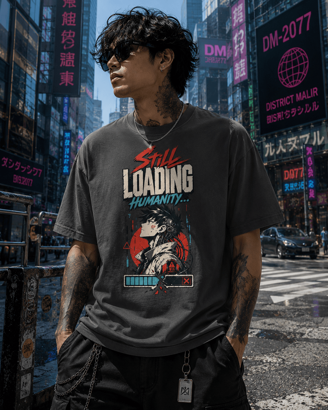 A man wearing a dark gray graphic t-shirt with a 'Still Loading Humanity.
