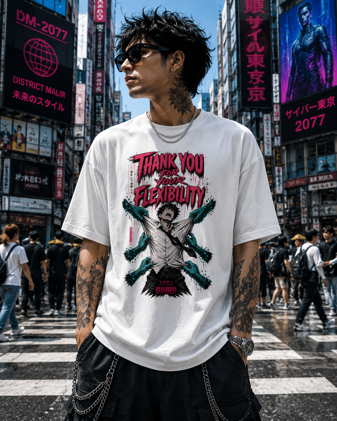 A man wearing a white graphic t-shirt with a red and black design that reads 'THANK YOU FOR YOUR FLEXIBILITY' and a character illustration, standing in a busy Japanese city street with neon signs.